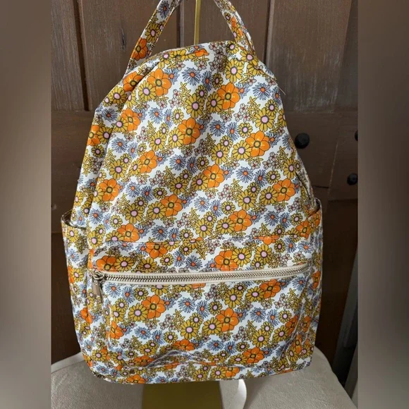 Add some color to your wardrobe with this Floral Orange and Yellow Backpack. - Picture 3 of 10
